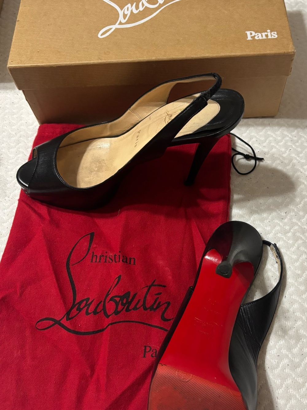 Christian Louboutin Black Leather Peep-Toe Slingback Heels with Red Sole.
